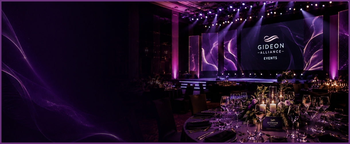 A candlelit gala table and stage produced by Gideon Alliance Events.